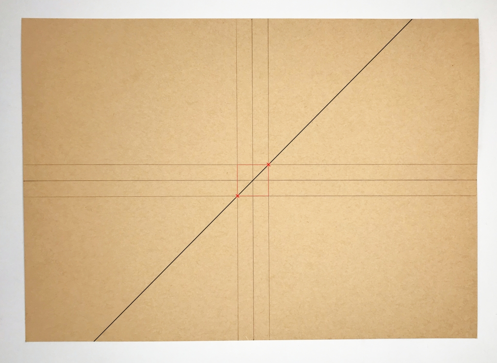 Drawing a diagonal line on kraft paper.